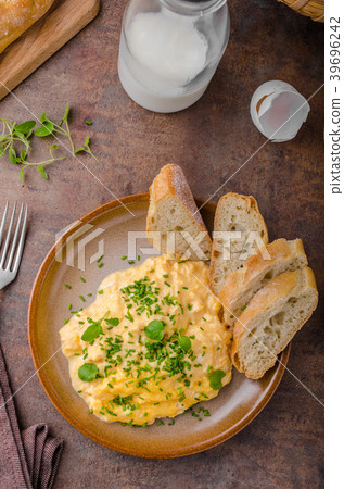 Scrambled eggs with herbs Scrambled eggs with herbs 39696242