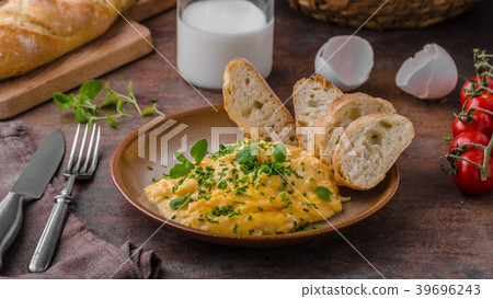 Scrambled eggs with herbs Scrambled eggs with herbs 39696243