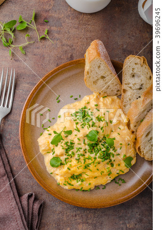 Scrambled eggs with herbs Scrambled eggs with herbs 39696245