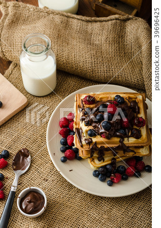 Waffles with fruits and chocolate 39696425