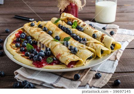 Pancakes with jam and blueberries 39697145