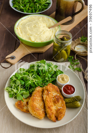 Schnitzel with mashed potatoes and salad Schnitzel with mashed potatoes and salad 39697496