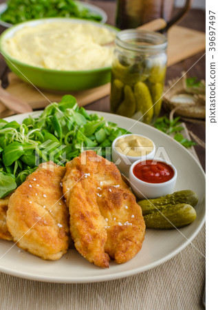 Schnitzel with mashed potatoes and salad Schnitzel with mashed potatoes and salad 39697497