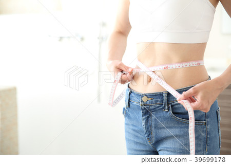 Women measuring waist 39699178