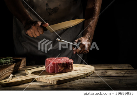 Chef butcher prepare beef steak Chef butcher prepare beef steak 39699983