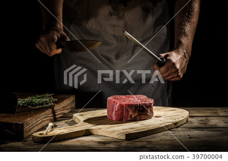 Chef butcher prepare beef steak Chef butcher prepare beef steak 39700004