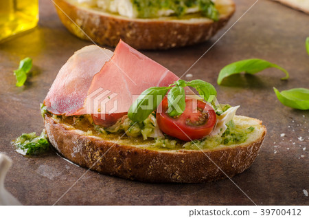 Toasted Tuscan bread with pesto Toasted Tuscan bread with pesto 39700412