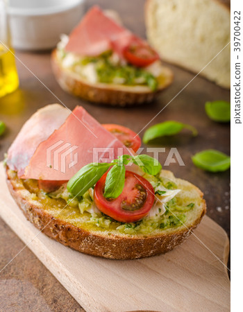 Toasted Tuscan bread with pesto Toasted Tuscan bread with pesto 39700422