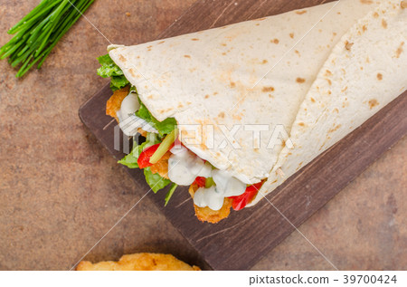 Tortilla with breaded chicken Tortilla with breaded chicken 39700424