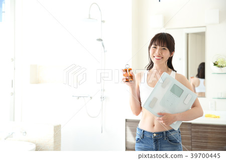 A woman with a scale 39700445