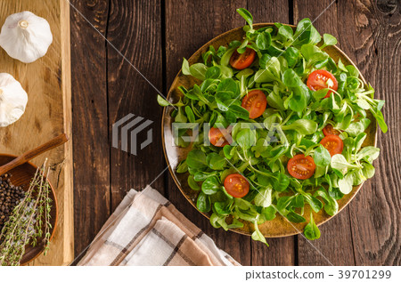 Lamb lettuce salad, tomatoes and herbs Lamb lettuce salad, tomatoes and herbs 39701299