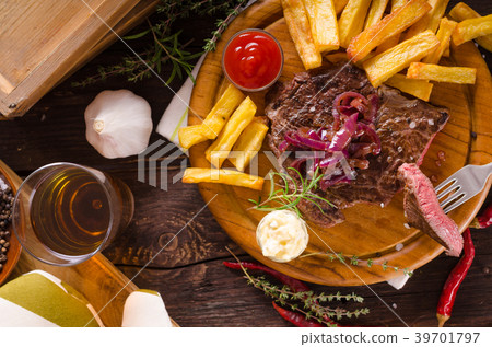 Beef steak with homemade french fries, beer and tartar sauce Beef steak with homemade french fries, beer and tartar sauce 39701797