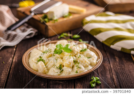 Cheese gnocchi with blue cheese sauce and galic 39701840