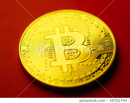Beautiful Golden bitcoin on red background Beautiful Golden bitcoin on red background 39702744