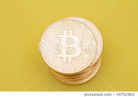 Stack of golden bitcoin on yellow brown concept Stack of golden bitcoin on yellow brown concept 39702963