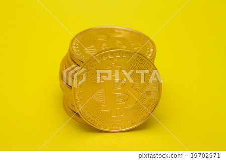 Stack of golden bitcoin on yellow brown concept Stack of golden bitcoin on yellow brown concept 39702971