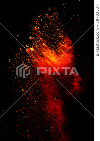 Redrange color powder explosion on  background. 39703837