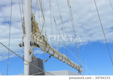 Fragment of the rigging of a sailing yacht against Fragment of the rigging of a sailing yacht against 39704155