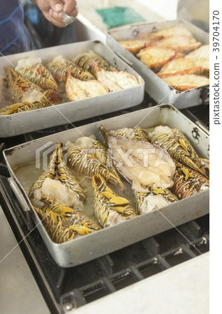 Lobster roasted on metal tray Red armor and white 39704170