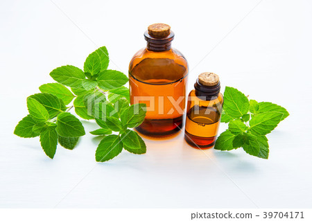 Natural Mint Essential Oil in a Glass Bottle. 39704171