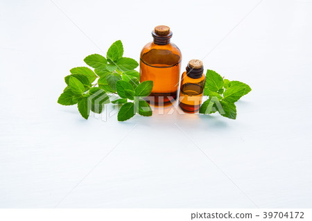 Natural Mint Essential Oil in a Glass Bottle. 39704172