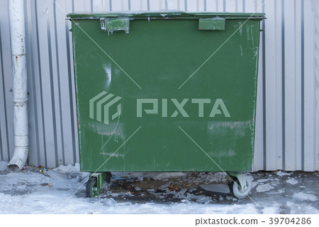 Green garbage bin. Municipal garbage dump. 39704286
