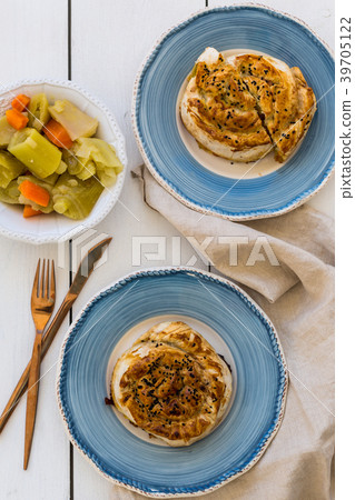 Turkish pastry borek in blue ceramic plates Turkish pastry borek in blue ceramic plates 39705122