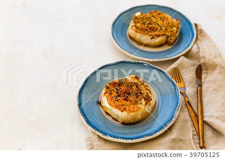 Turkish pastry borek in blue ceramic plate Turkish pastry borek in blue ceramic plate 39705125