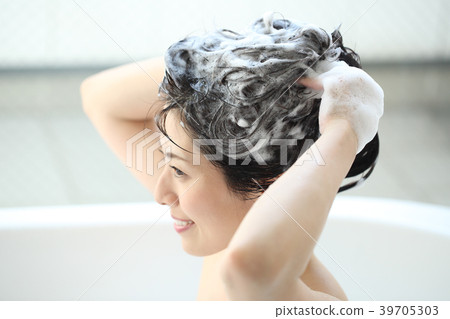 Woman washing her head Woman washing her head 39705303