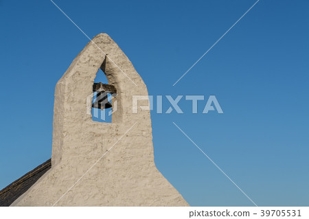 Small bell tower against a deep blue sky Small bell tower against a deep blue sky 39705531