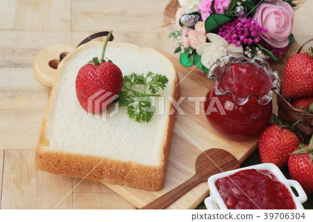 Strawberry jam with slice of bread delicious 39706304