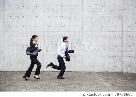 Running business woman and businessman 39706603