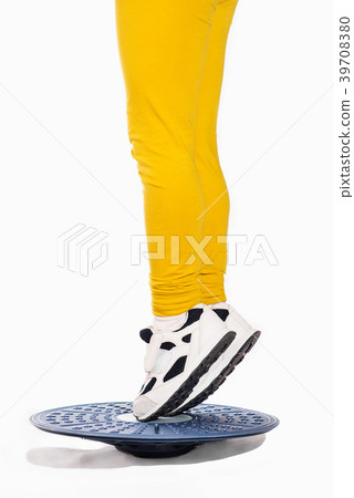 Little girl in on the tips of toes position on 39708380