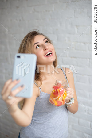 Pretty young caucasian girl taking selfie. 39710788