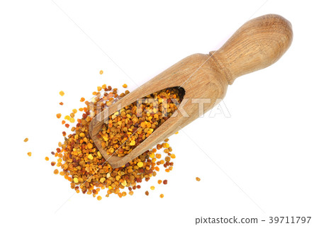 fresh bee pollen in wooden scoop isolated on white fresh bee pollen in wooden scoop isolated on white 39711797