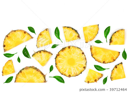 Sliced pineapple decorated with green leaves 39712464