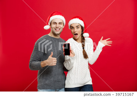 Christmas concept - Happy young couple in Christmas concept - Happy young couple in 39715167