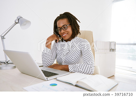 Business woman checking e-mails Business woman checking e-mails 39716710
