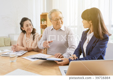 Senior couple with financial consultant Senior couple with financial consultant 39716864