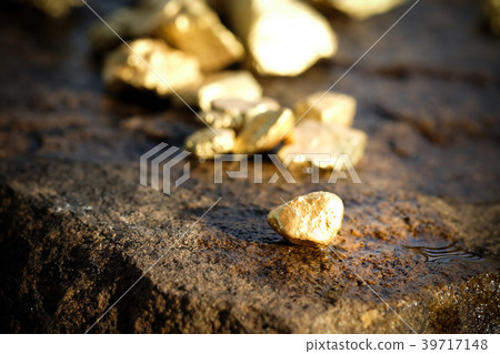 The pure gold ore found in the mine on stone floor The pure gold ore found in the mine on stone floor 39717148