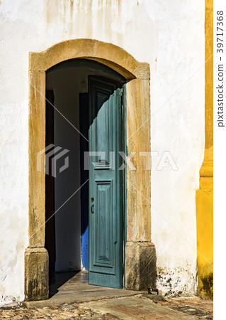 Old blue and green wooden church door stone framed Old blue and green wooden church door stone framed 39717368