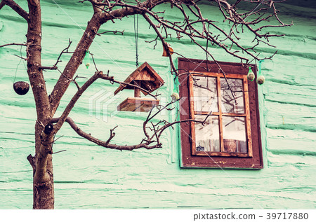 Bird house with feed on tree in Vlkolinec village Bird house with feed on tree in Vlkolinec village 39717880