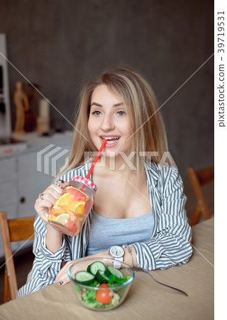 Young woman enjoing with fresh summer lemonade Young woman enjoing with fresh summer lemonade 39719531