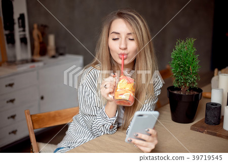 Young woman enjoing with fresh summer lemonade Young woman enjoing with fresh summer lemonade 39719545