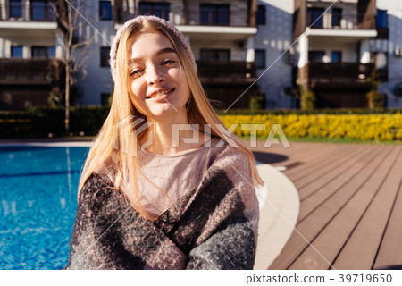 girl enjoying the warm spring weather, blue pool girl enjoying the warm spring weather, blue pool 39719650