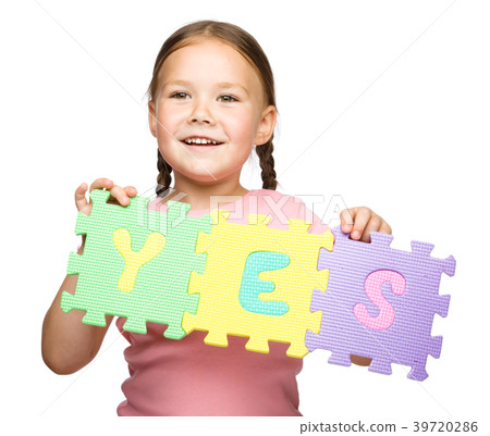 Cute little girl is holding Yes slogan Cute little girl is holding Yes slogan 39720286