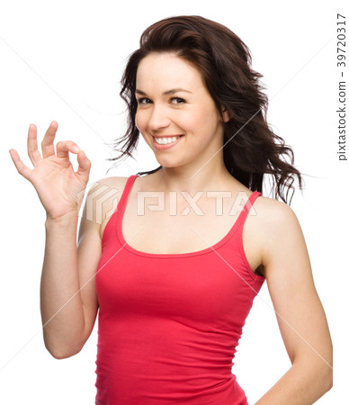 Woman is showing OK sign 39720317