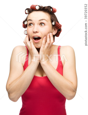 Woman is holding her face in astonishment 39720352