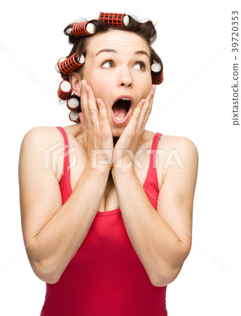 Woman is holding her face in astonishment 39720353