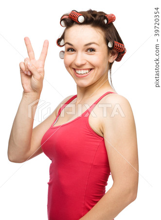 Woman is showing victory sign 39720354